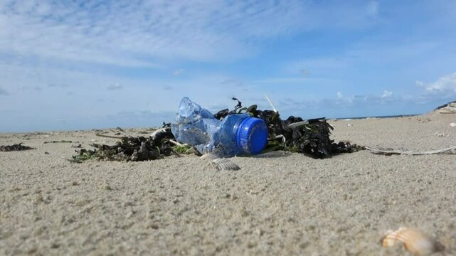 Borkum Germany Northern beaches. Despite being one of the cleaner beaches on the North Sea plastic single use plastic waste can still be found. In this case a water bottle.