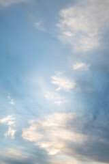 Obraz premium Image of a blue sky with clouds. Vertical frame.