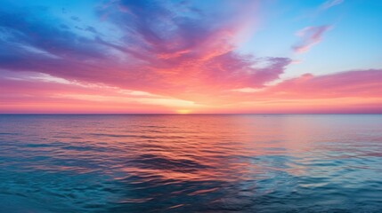 Obraz premium Sunset Over Calm Ocean Waters with Vibrant Colors and Serene Atmosphere Perfect for Tranquil and Scenic Stock Photography