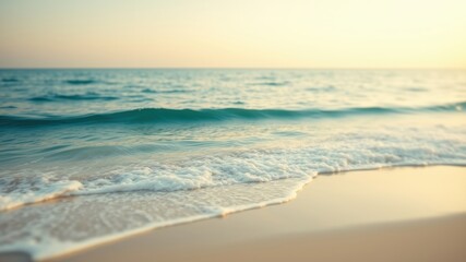 Obraz premium Serene Coastal Scene Gentle Waves Caressing a Sandy Shore at Sunset