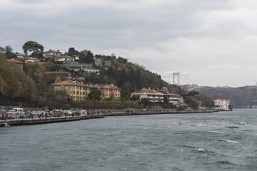 Fototapeta premium Beautiful view of the Bosphorus shore on a cloudy day, full of residential houses, Istanbul, Turkey.
