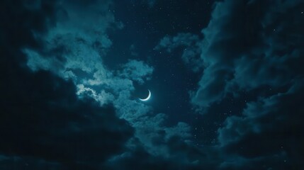 Obraz premium dramatic night sky photograph of crescent moon emerging from dark clouds, stars twinkling in deep blue atmosphere