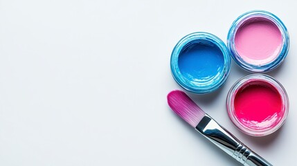 Vibrant Pink and Blue Paints with Paintbrush on White Background