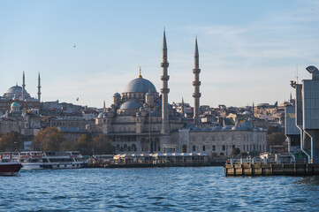 Fototapeta premium New mosque on a sunny day, Eminonyu district, Istanbul, Turkey. View from Galata Bridge