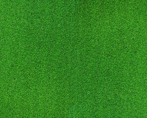 Artificial grass, covering. Artificial green grass mat, top view. Texture. Background. Artificial turf, surface made of synthetic fibers. Flat green grass texture background. Short grass