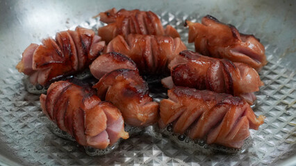 Grill the cut-out Vienna sausage in a pan