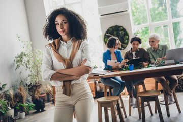 Fototapeta premium Photo of successful corporate women folded arms develop project modern interior office business center indoors