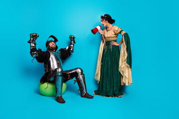 A knight and a princess in an amusing comparison of medieval attire and modern glow against a...