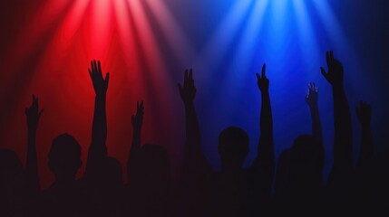 Silhouetted crowd raising hands under red and blue stage lights.