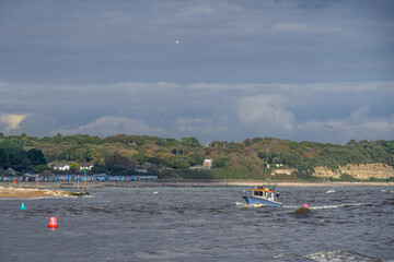 Small fishing trawler in the sea on a windy day Mudeford Dorset England 