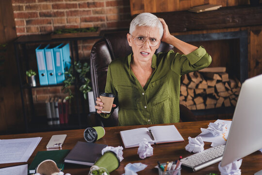 Photo of sad uspet charming lady spill coffee workplace workstation messy table interior indoors