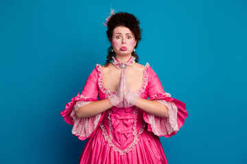 Photo of funny attractive lady dressed baroque costume begging you copy space isolated blue color...