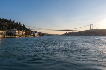 Beautiful sunset view of the Bosphorus shore, full of residential houses, Istanbul, Turkey.