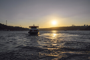 Fototapeta premium Amazing view of the Bosphorus and ferry at sunset, Istanbul, Turkey.