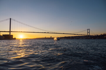Beautiful view of the Bosphorus and the Bosphorus Bridge in the background at sunset.