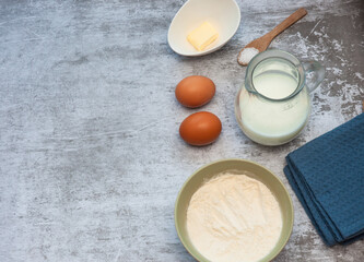 Baking cooking ingredients on a grey background. Nobody.