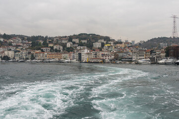 View of the pier Arnavutkoy (Arnavutk&ouml;y iskelesi, Beşiktaş) in the Besiktash area on the Bosphorus embankment. Cloudy day.