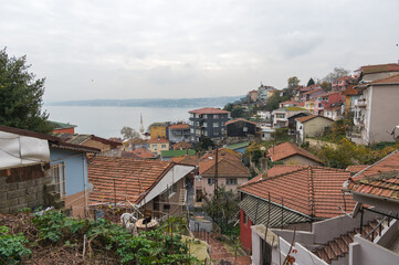 Fototapeta premium Roofs of houses and view of the Bosphorus, Sariyer, Istanbul, Turkey