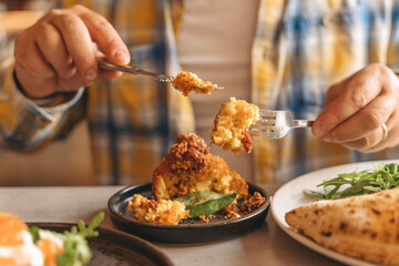 Dining experience of delicious dish at cozy restaurant during lunchtime