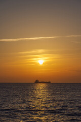 Fototapeta premium Stunning sunset on the Marmara Sea and vessel, next to the Bosphorus, Istanbul, Turkey