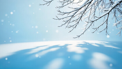 Beautiful winter background of snow and blurred forest in background, Gently falling snow flakes against blue sky. Wide panorama format.