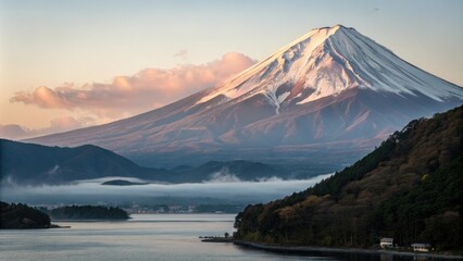 Obraz premium Gentle mist surrounding majestic Mount Fuji as it basks in warm evening light, mount fuji, atmospheric effect, evening atmosphere