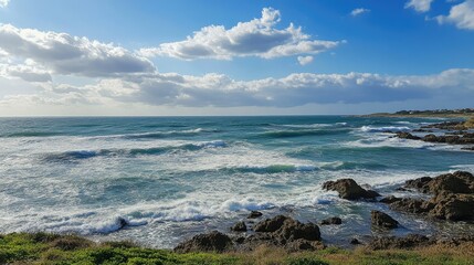 Obraz premium A serene seascape featuring gently rolling ocean waves, captured in soft, fluid motion.