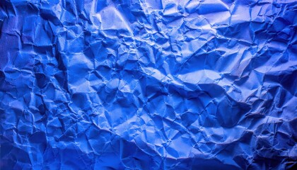 Obraz premium textured close-up of crumpled blue paper with intricate folds and shadows, ideal for background, design projects, or graphic art use