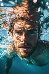 Man Swimming in Blue Ocean