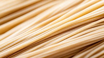 A closeup of freshly boiled soba noodles, their texture glistening under warm light, paired with traditional toppings