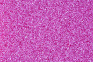 purple background, photo shows texture of purple foam sponge close-up