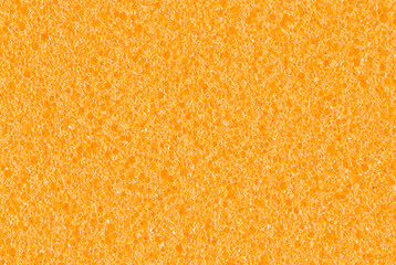 yellow background, photo shows texture of yellow foam sponge close-up
