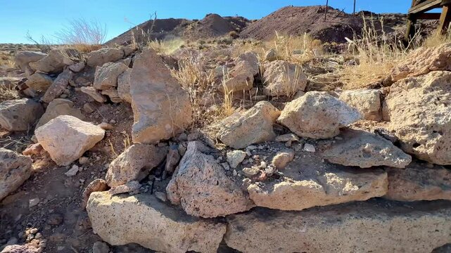 Weathered and rustic, abandoned historic mining equipment stands as silent sentinels in the arid desert landscape near Beatty, Nevada, offering a glimpse into the region's rich gold rush heritage and 