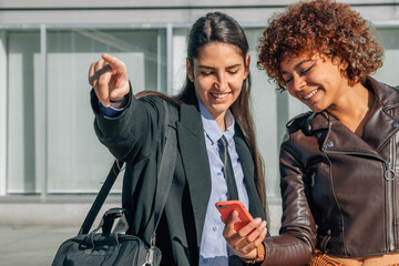 girl showing the address showing the mobile phone