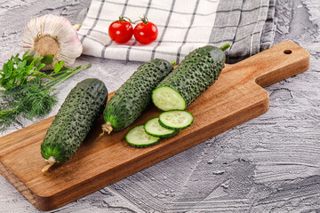 Raw green cucumbers with slices