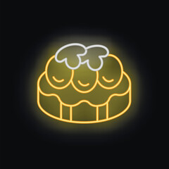 Yellow neon sign showing a round cake with cream on top, on a black background