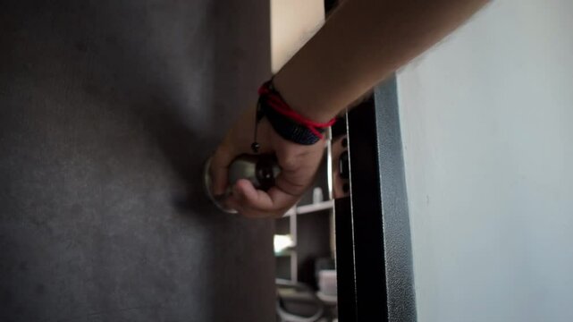 Closing a Door, Hand Turning a Door Handle, Door Shutting Motion, Privacy and Security Action, Everyday Life Concept, Modern Door Mechanism, Closing Room Access. High quality FullHD footage