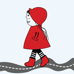 A cute baby walking on the road.