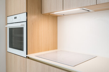 Modern kitchen design featuring stylish induction hob and built-in oven