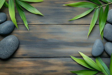 Organic Nature Background with Green Bamboo Leaves and Polished Stones on Rustic Wooden Texture
