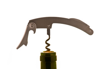 Corkscrew tool opening a wine bottle for celebratory occasion in a minimalist setting