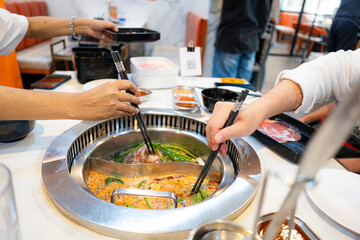 Close up anonymous people eating buffet food on lunch