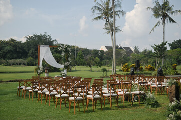 Guest seating arrangement and altar in the field during the day for wedding ceremonies