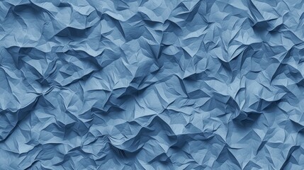 Obraz premium Crumpled blue paper forming a textured, abstract background, providing a distinctive visual element perfect for a range of design applications and creative projects
