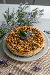 homemade cheesecake with nuts. decorated with flowers on a table at home