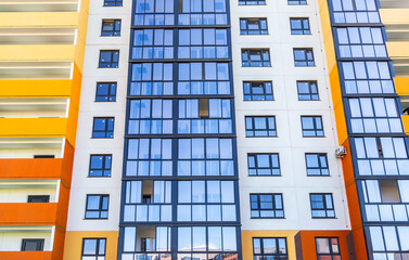 Fototapeta premium Facade of new bright colorful modern residential building