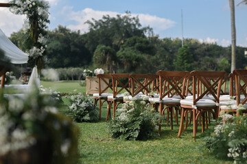 Guest seating arrangement and altar in the field during the day for wedding ceremonies