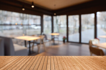 Empty wooden table in restaurant, space for design