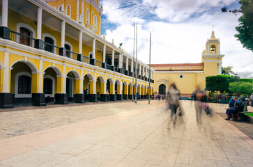View of the Departmental Government Building of the city of Huhuetenango. Businesspeople walk...