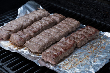 Cevapi on the grill.